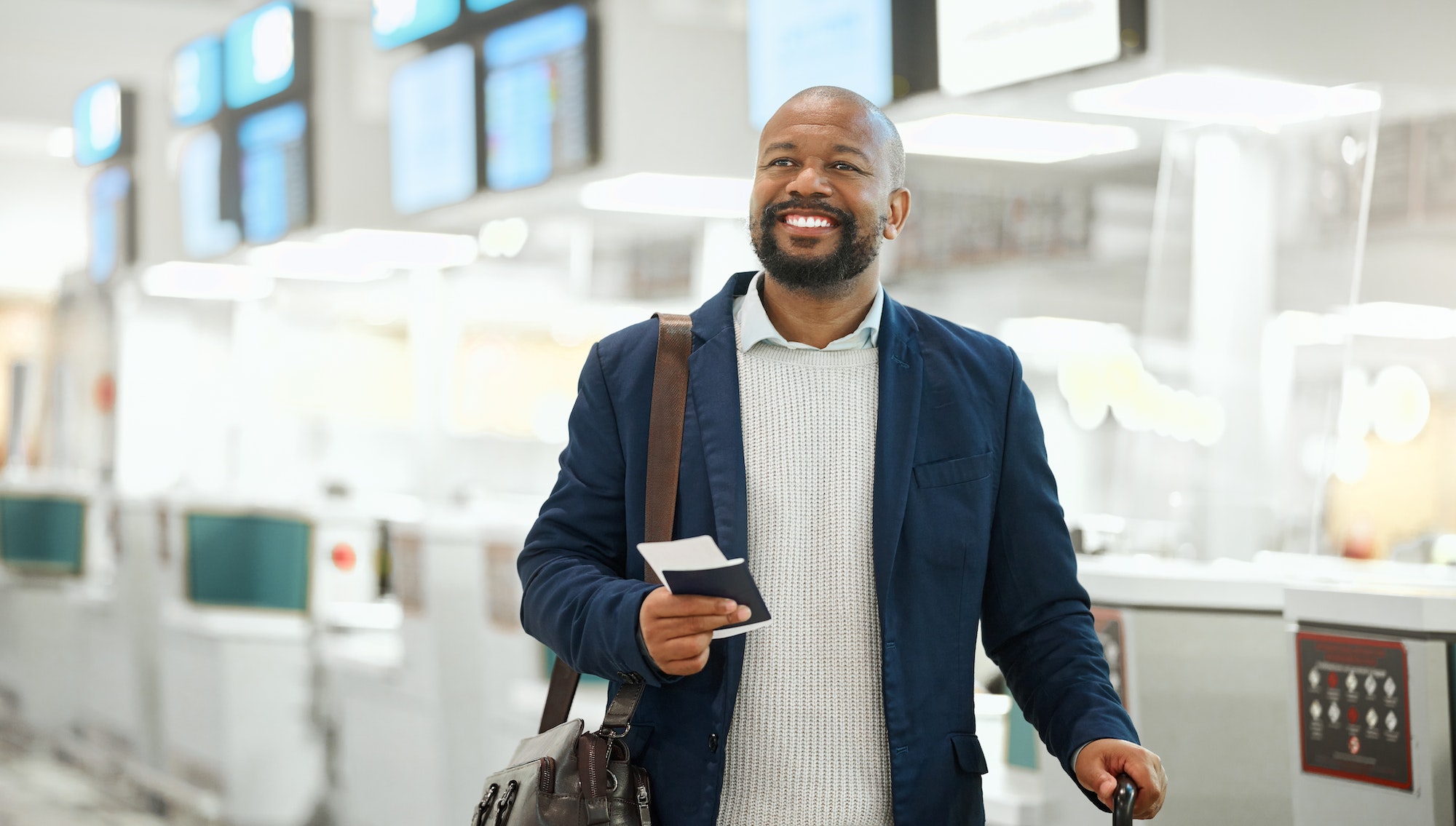 African businessman, ticket and luggage at airport with excited smile, focus and happy business tri